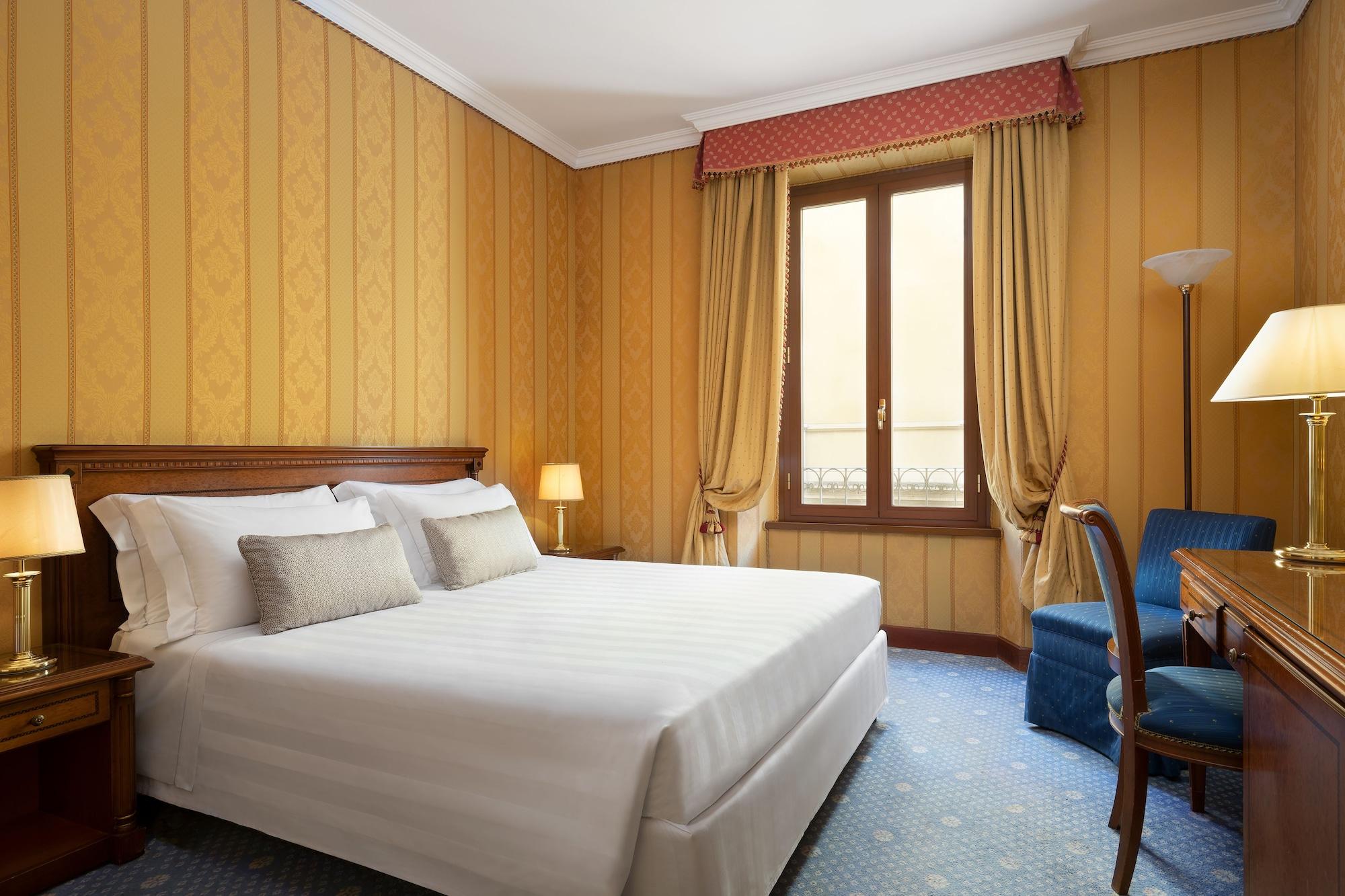 โรงแรมซินา บรูฟานี เปรูจา ภายนอก รูปภาพ A room at the hotel